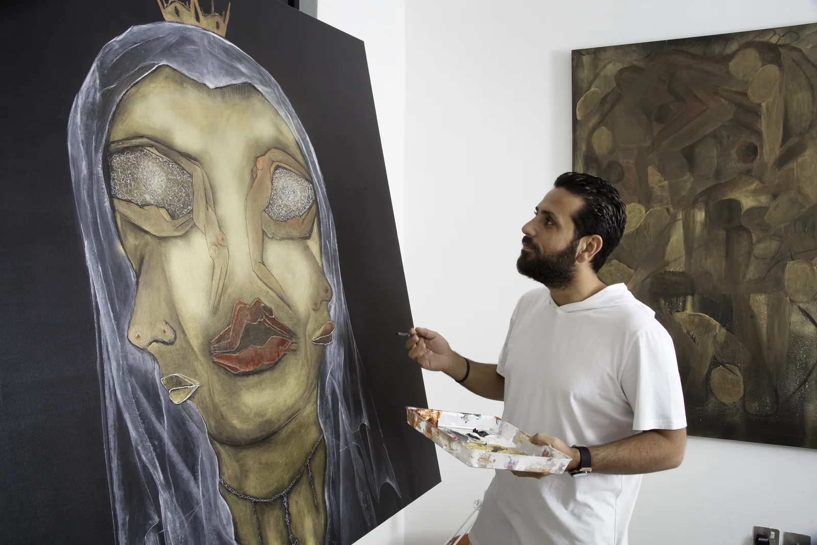Yazan Orabi painting in his studio